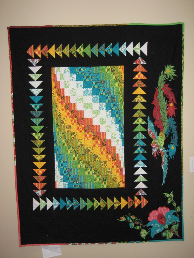 Circa 2009 Flights of Fancy. The fabric is Tula Pink Nest., and those are 3D flying geese!